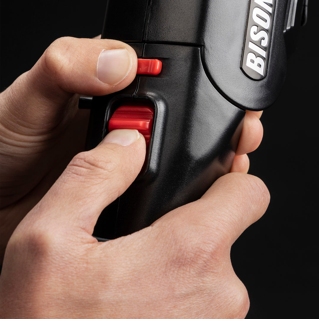 Image of Airlighter 520 child-safety button operation.