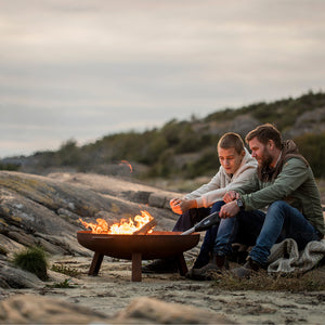 Father and son enjoying a fire pit with the Airlighter