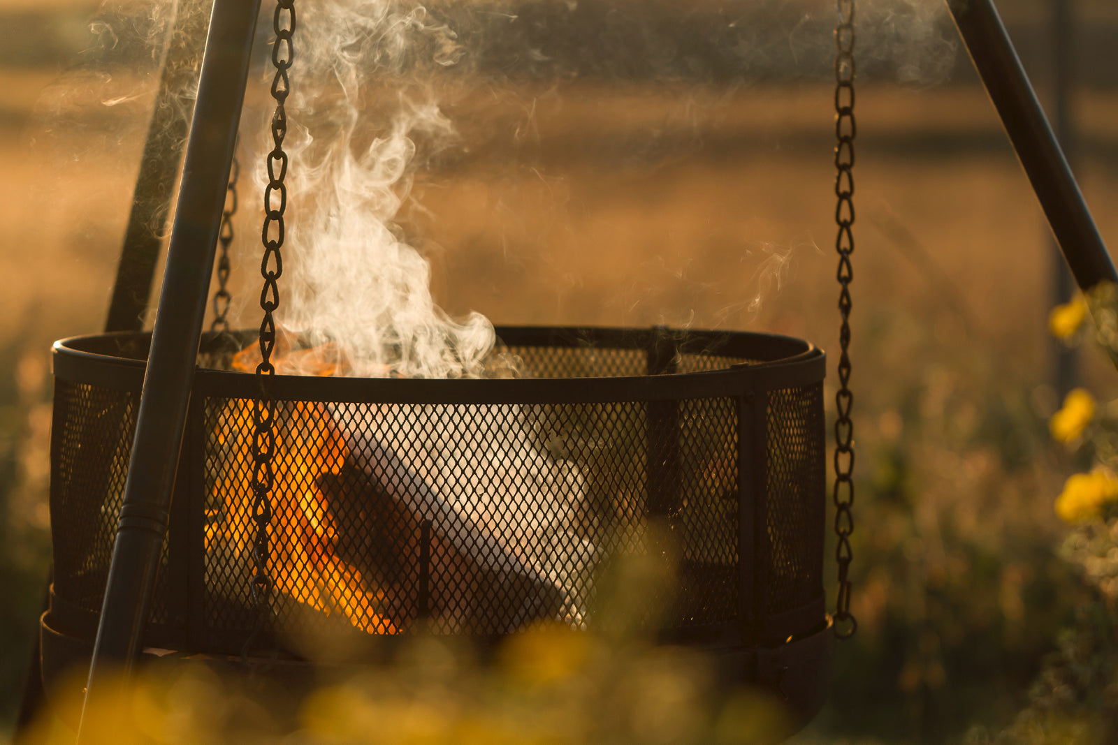 Fire and wood smoking in a camping fire pit