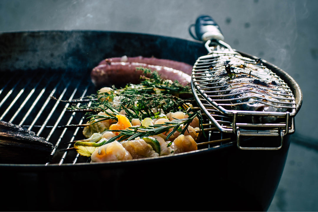 Image of grill with fish and meat.
