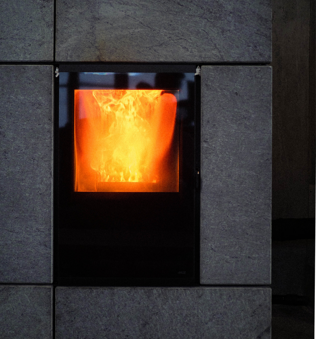 Image of a modern woodstove fireplace with fire inside