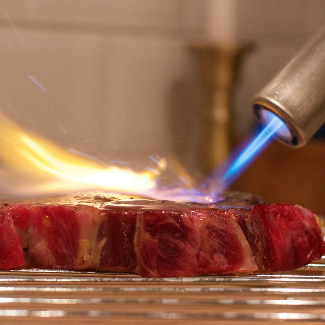 Image of Airlighter flame on searing meat. 